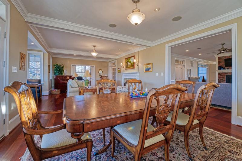 The dining room of the house is open to the family room with a large entry from the kitchen area