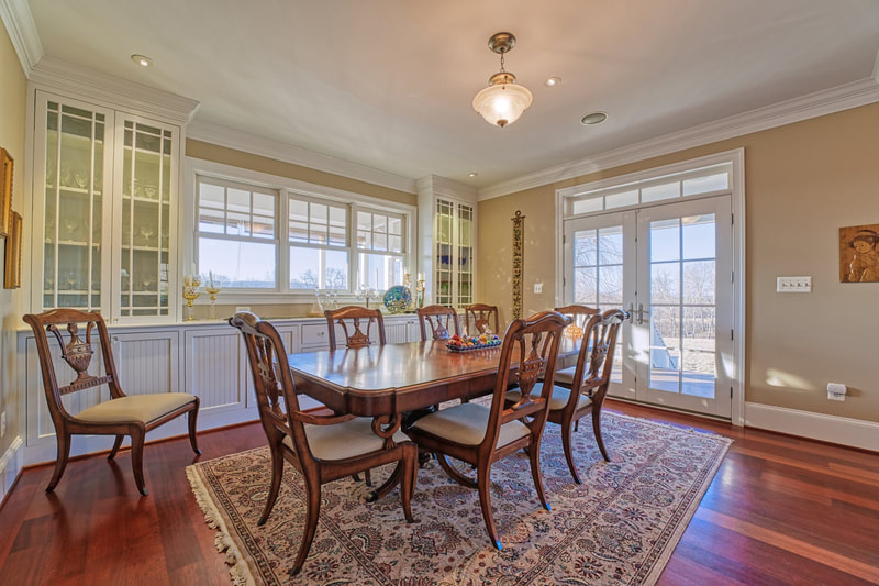 The dining room has very nice hardwood floors and plenty of windows and cabinets